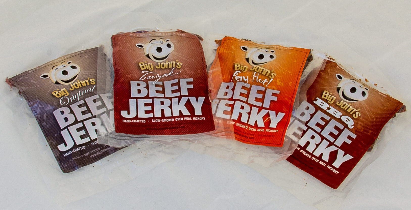 Big John's Beef Jerky, featuring Original, Teriyaki, Fiery Hot and BBQ, all the classic flavors, and hickory smoked with the Big John's classic technique